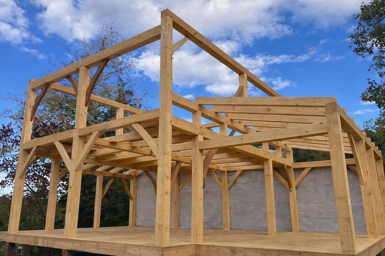 custom timber frame high efficiency new house utilizing natural and beautiful curved aesthetic